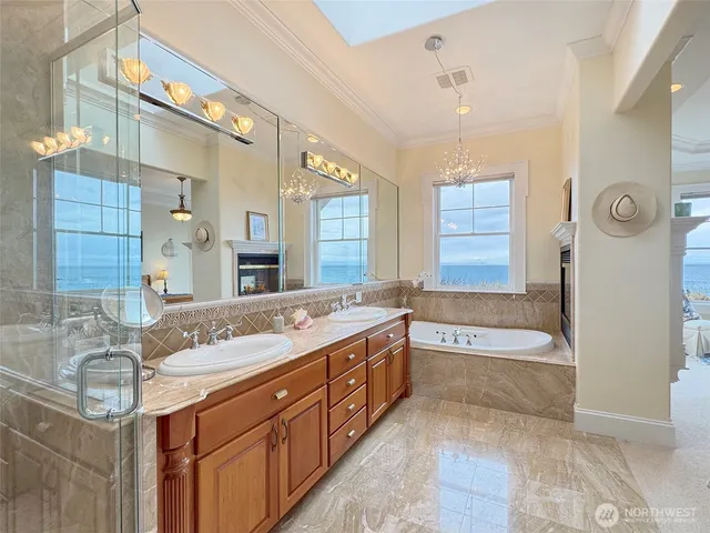 a spacious bathroom with a granite countertop sink mirror and a shower
