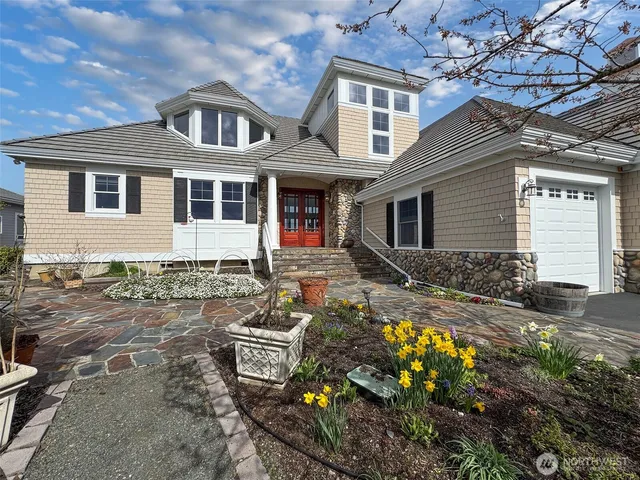 a front view of a house with garden