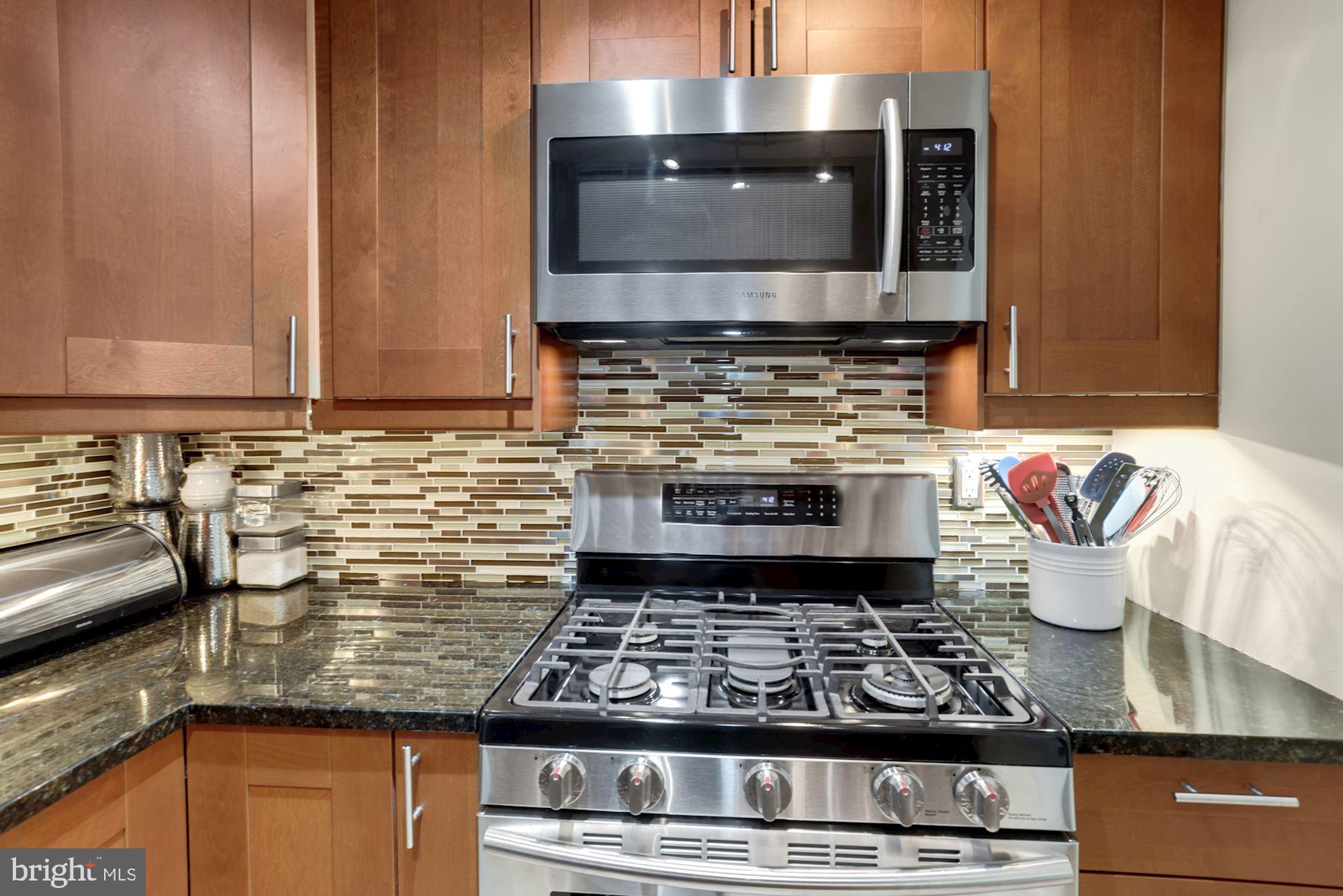 300 M Street Southwest, Unit N200 Washington, DC 20024 - Photo 13 of 45 Gorgeous glass tile backsplash accents kitchen