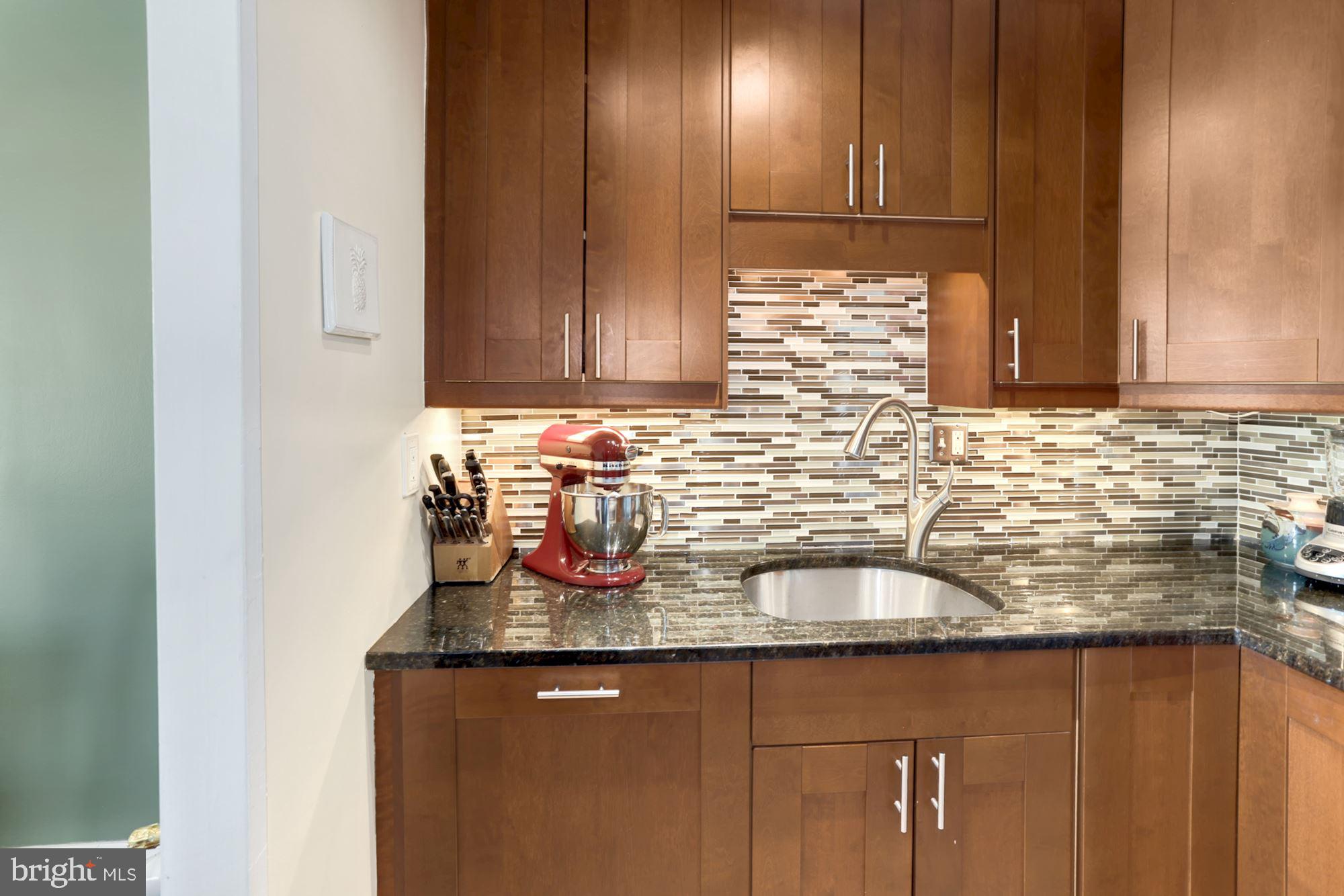 300 M Street Southwest, Unit N200 Washington, DC 20024 - Photo 15 of 45 Kitchen with Maple cabinets and ample storage