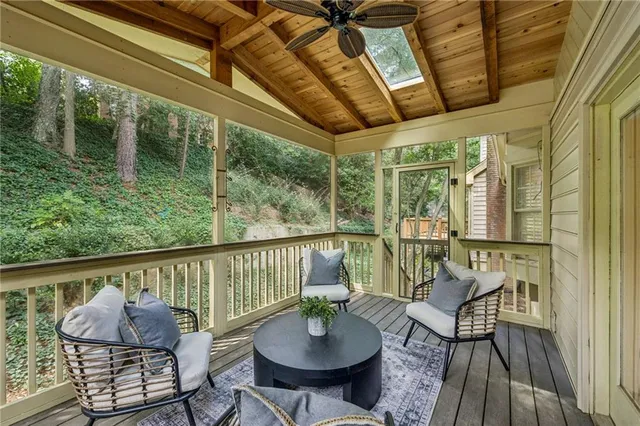 a view of a chairs and table in the balcony