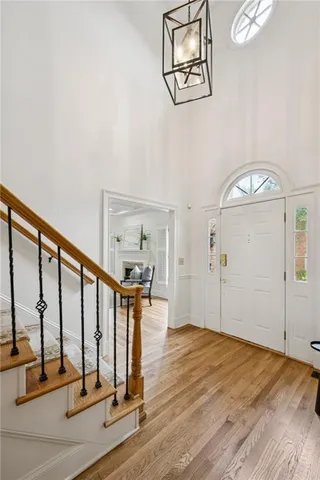 a view of an entryway with wooden floor