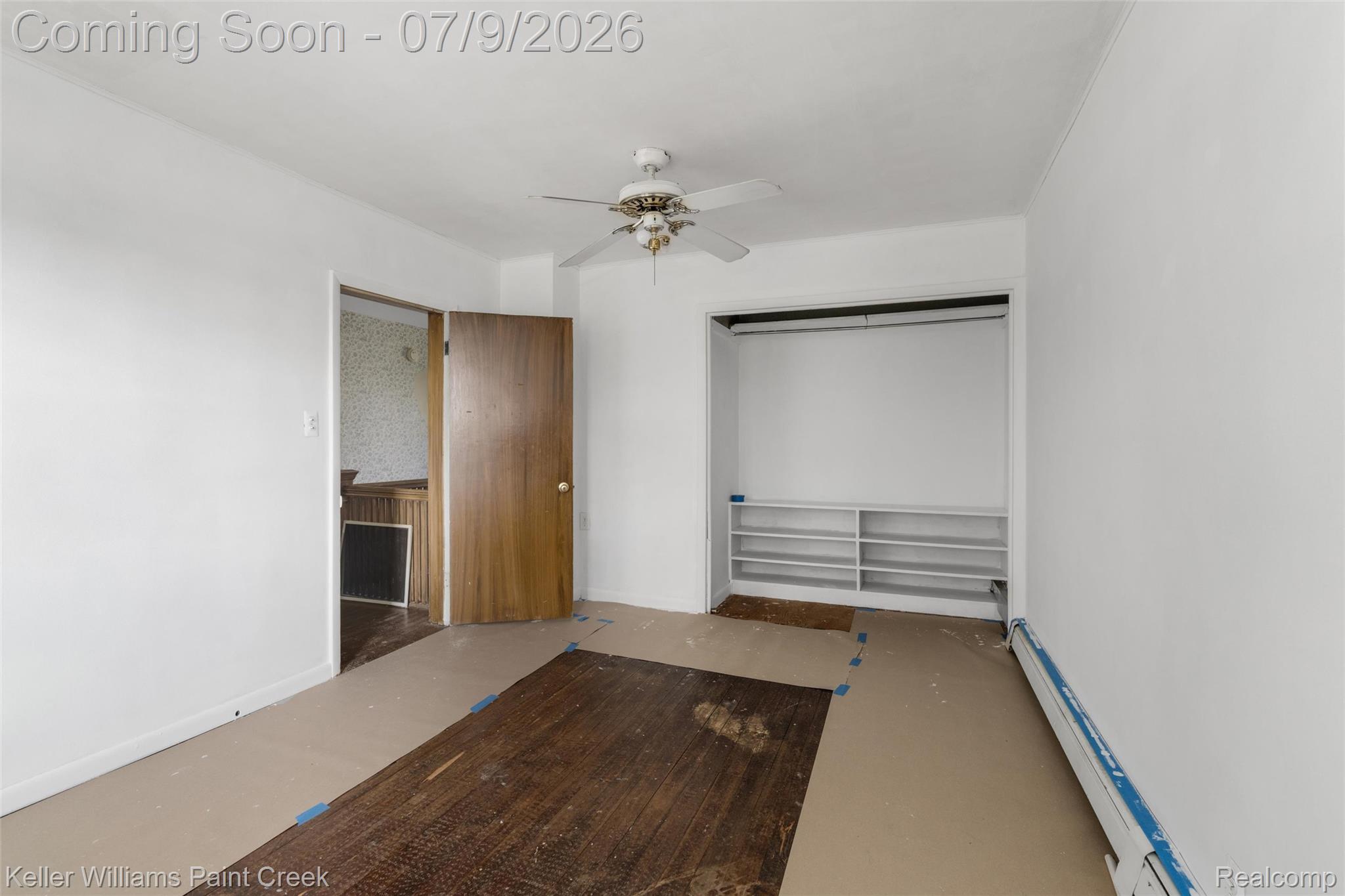 28780 School Section Road Richmond, MI 48062 - Photo 10 of 50 Room featuring a ceiling fan, a built-in closet with shelving, and wood-finish flooring