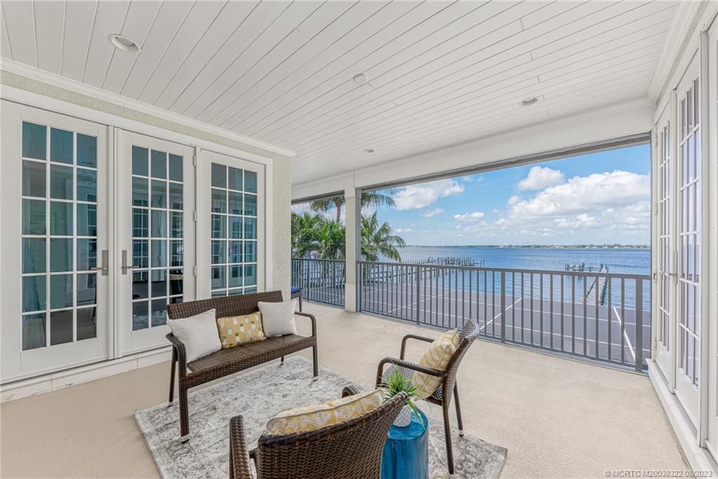 1455 Southeast Riverside Drive Stuart, FL 34996 - Photo 87 of 100 2nd floor patio between MBR and other large Guest BR is screened for your pleasure. Catch the breeze without the bugs!