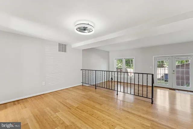 a view of a room with wooden floor