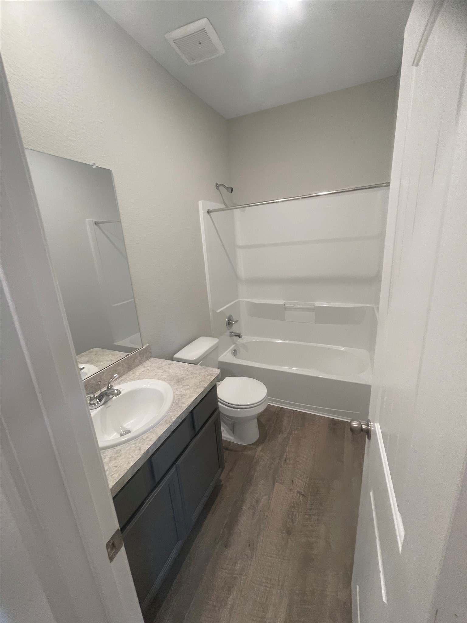 25421 Honus Wagner Way Splendora, TX 77372 - Photo 17 of 24 a bathroom with a granite countertop sink toilet and shower