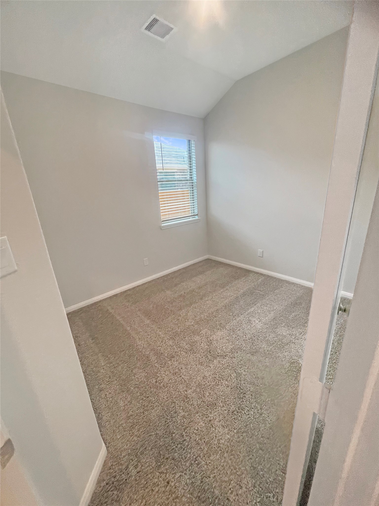 25421 Honus Wagner Way Splendora, TX 77372 - Photo 19 of 24 an empty room with windows