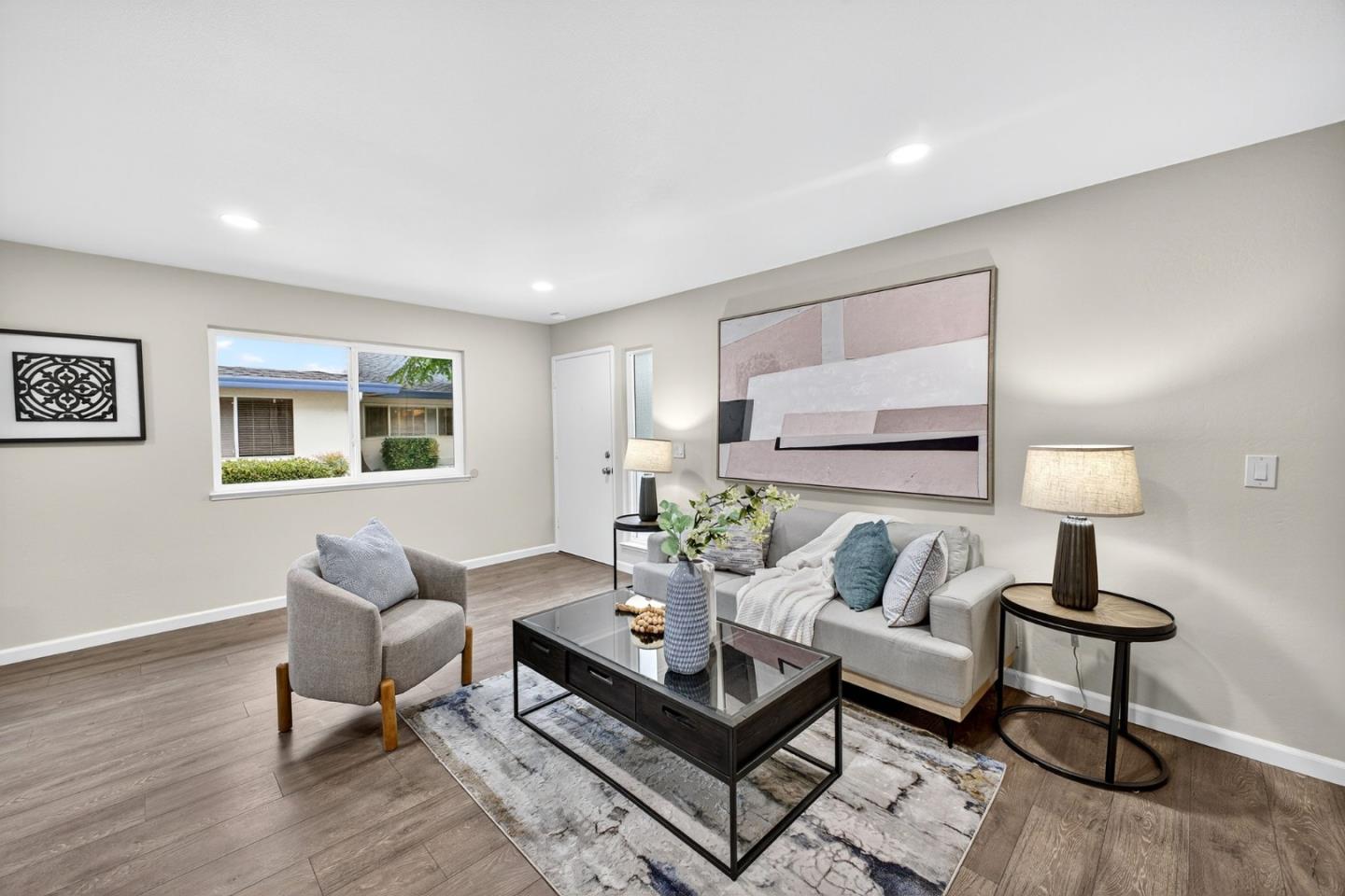 375 North 3rd Street, Unit 3 Campbell, CA 95008 - Photo 2 of 27 a living room with furniture and a lamp
