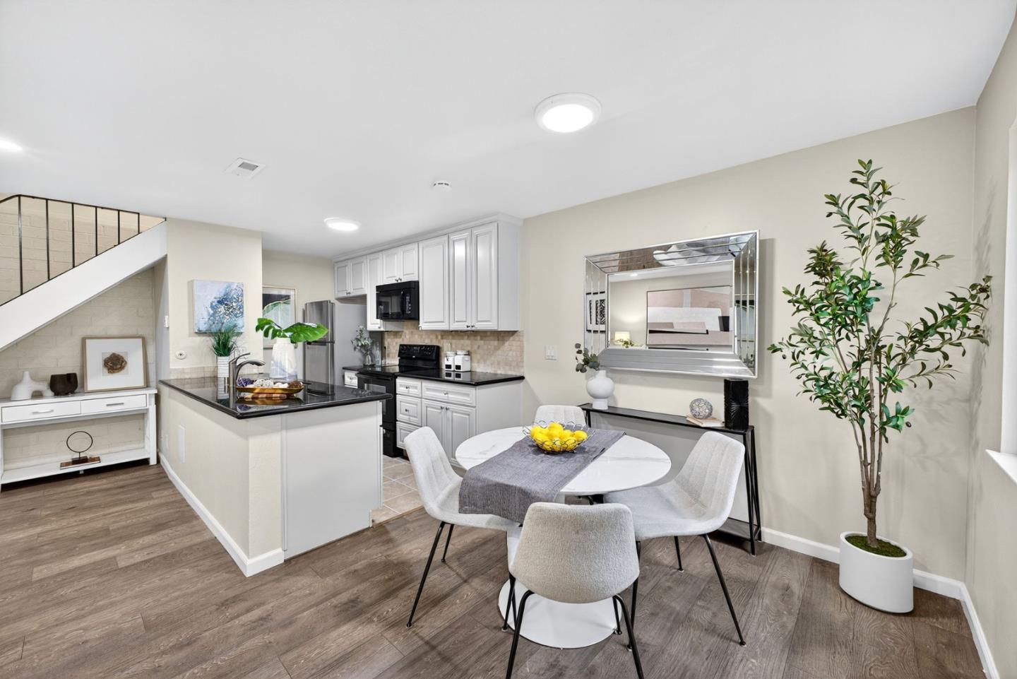 375 North 3rd Street, Unit 3 Campbell, CA 95008 - Photo 5 of 27 a kitchen with a sink dining table and chairs