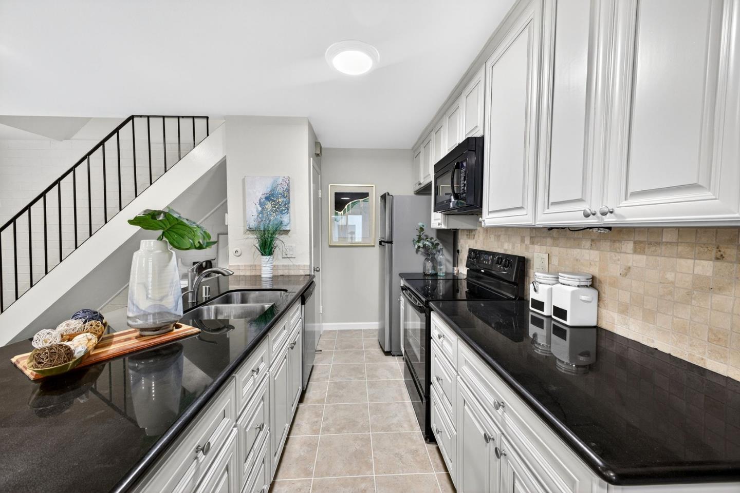 375 North 3rd Street, Unit 3 Campbell, CA 95008 - Photo 6 of 27 a kitchen with kitchen island granite countertop lots of counter top space and stainless steel appliances