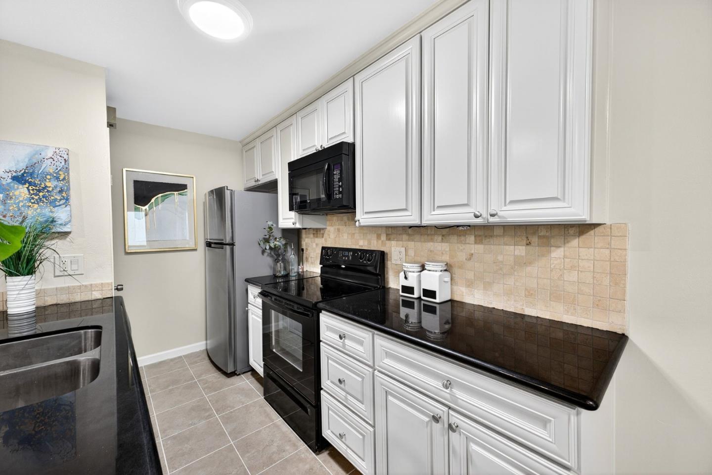 375 North 3rd Street, Unit 3 Campbell, CA 95008 - Photo 8 of 27 a kitchen with a refrigerator stove and microwave