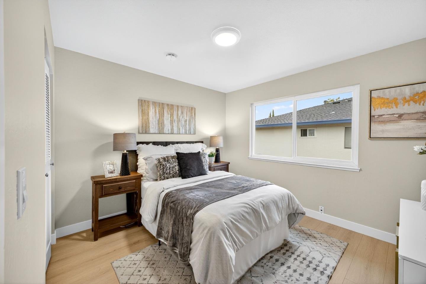 375 North 3rd Street, Unit 3 Campbell, CA 95008 - Photo 9 of 27 a bedroom with a large bed and a window