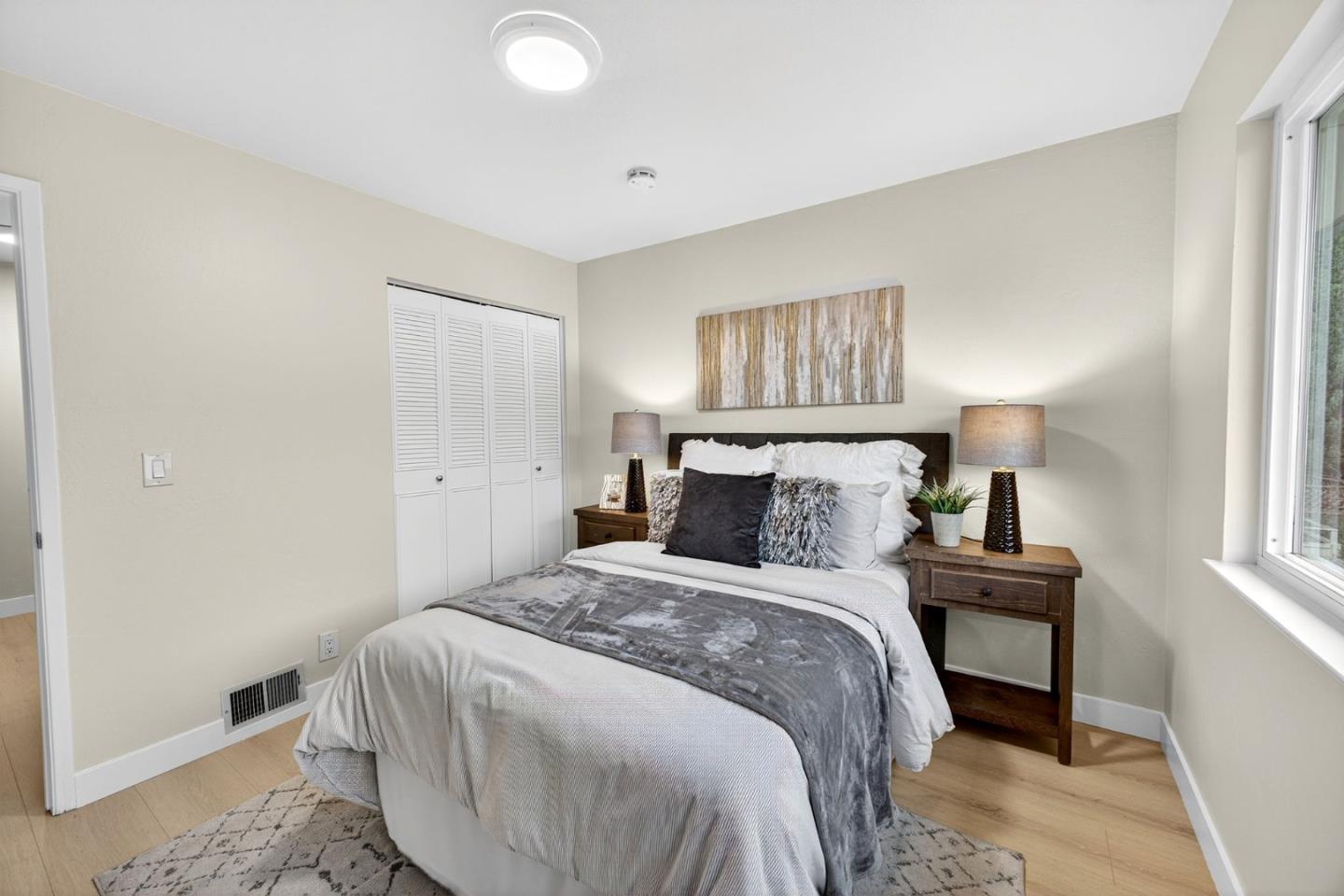 375 North 3rd Street, Unit 3 Campbell, CA 95008 - Photo 10 of 27 a bedroom with a bed and wooden floor