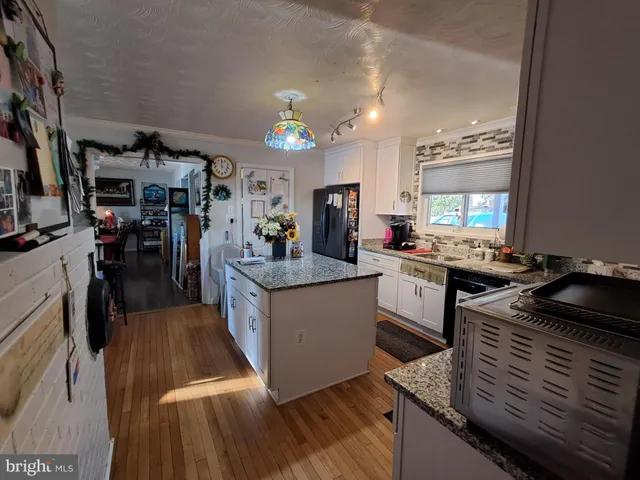 a kitchen with counter top space and stainless steel appliances