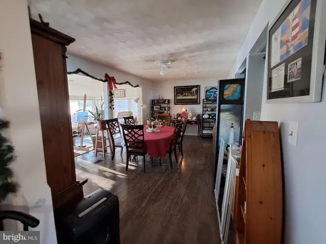 a view of a dining room with furniture and chandelier