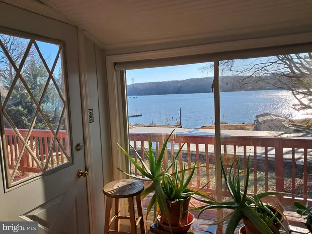 a view of a porch with furniture and garden