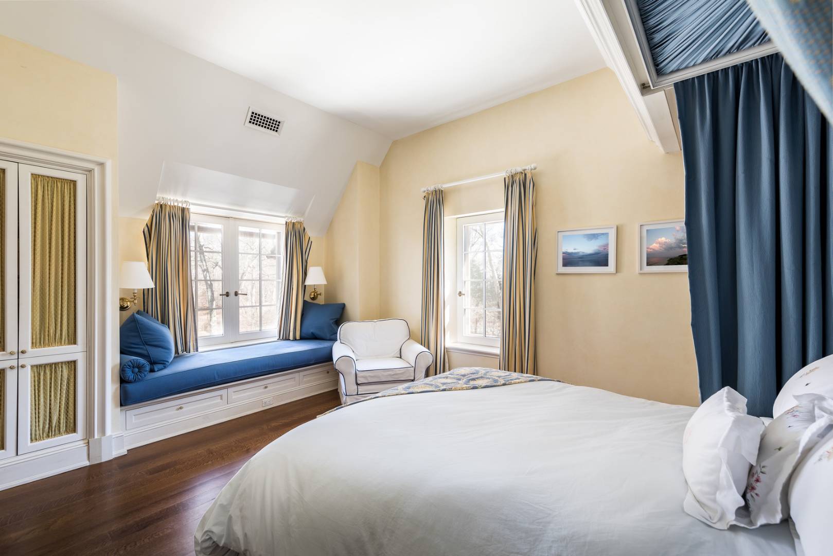 36 Briar Patch Road East Hampton, NY 11937 - Photo 12 of 17 a bedroom with a bed and large windows