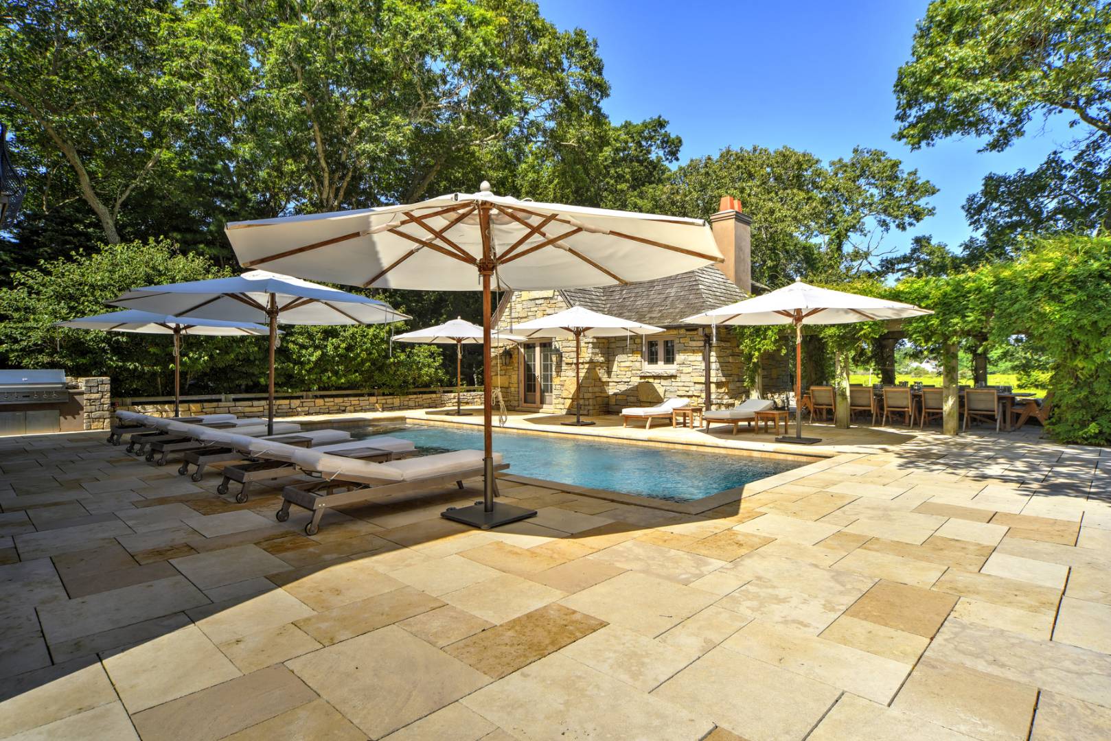 36 Briar Patch Road East Hampton, NY 11937 - Photo 14 of 17 a view of swimming pool with sitting area