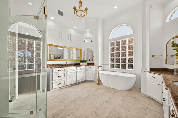 a large white kitchen with a window