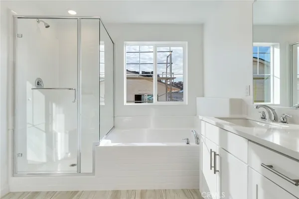 a white bath tub sitting next to a white sink