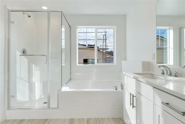 a white bath tub sitting next to a white sink