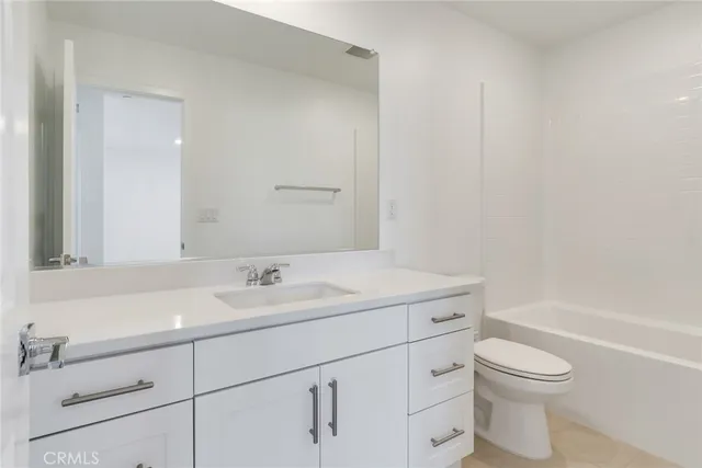 a bathroom with a sink a toilet and a bathtub