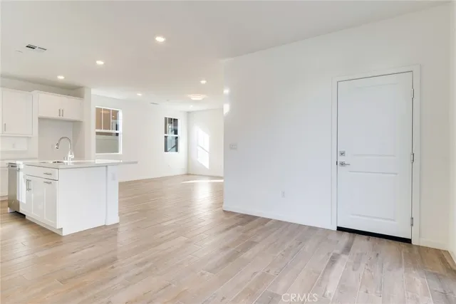 a view of kitchen with furniture and wooden floor