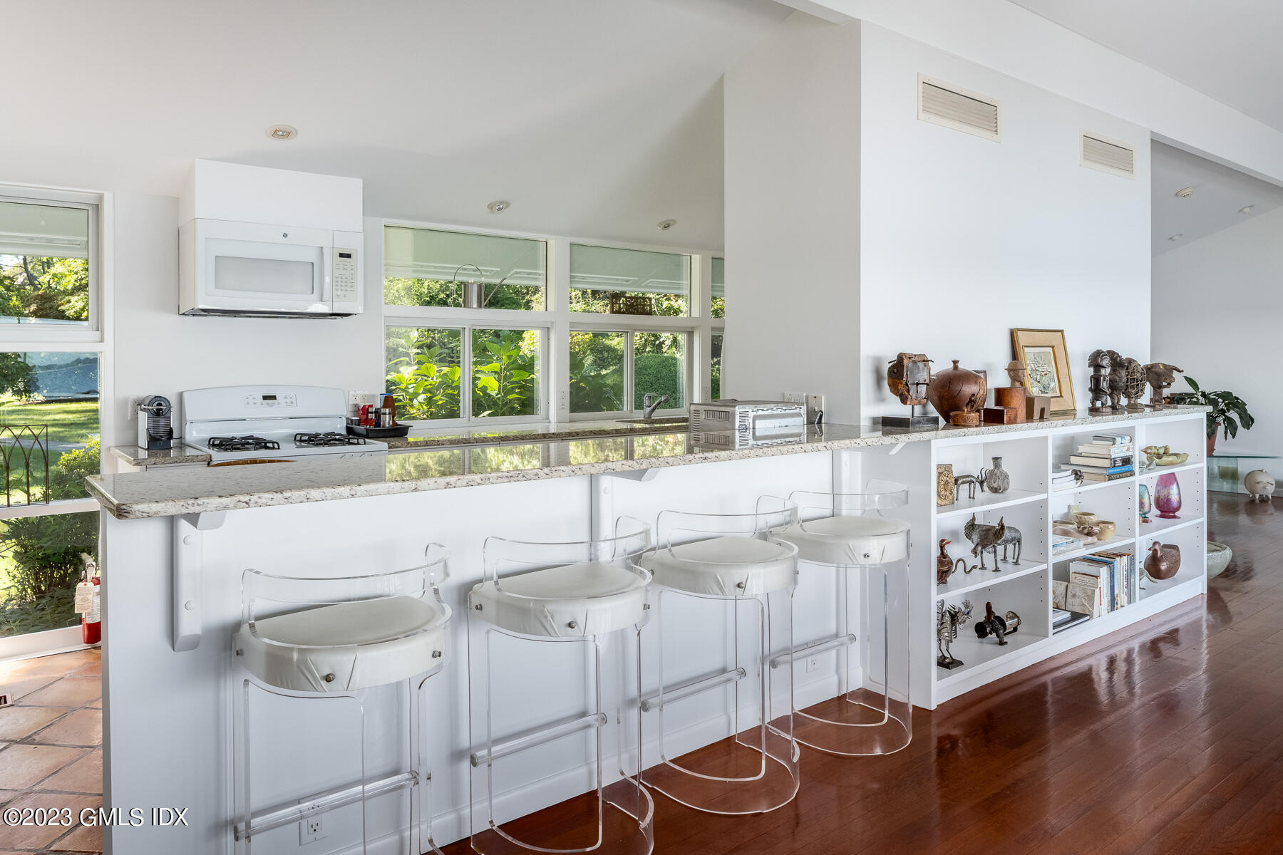 201 Byram Shore Road Greenwich, CT 06830 - Photo 8 of 23 a kitchen with stainless steel appliances cabinets a large window and a sink