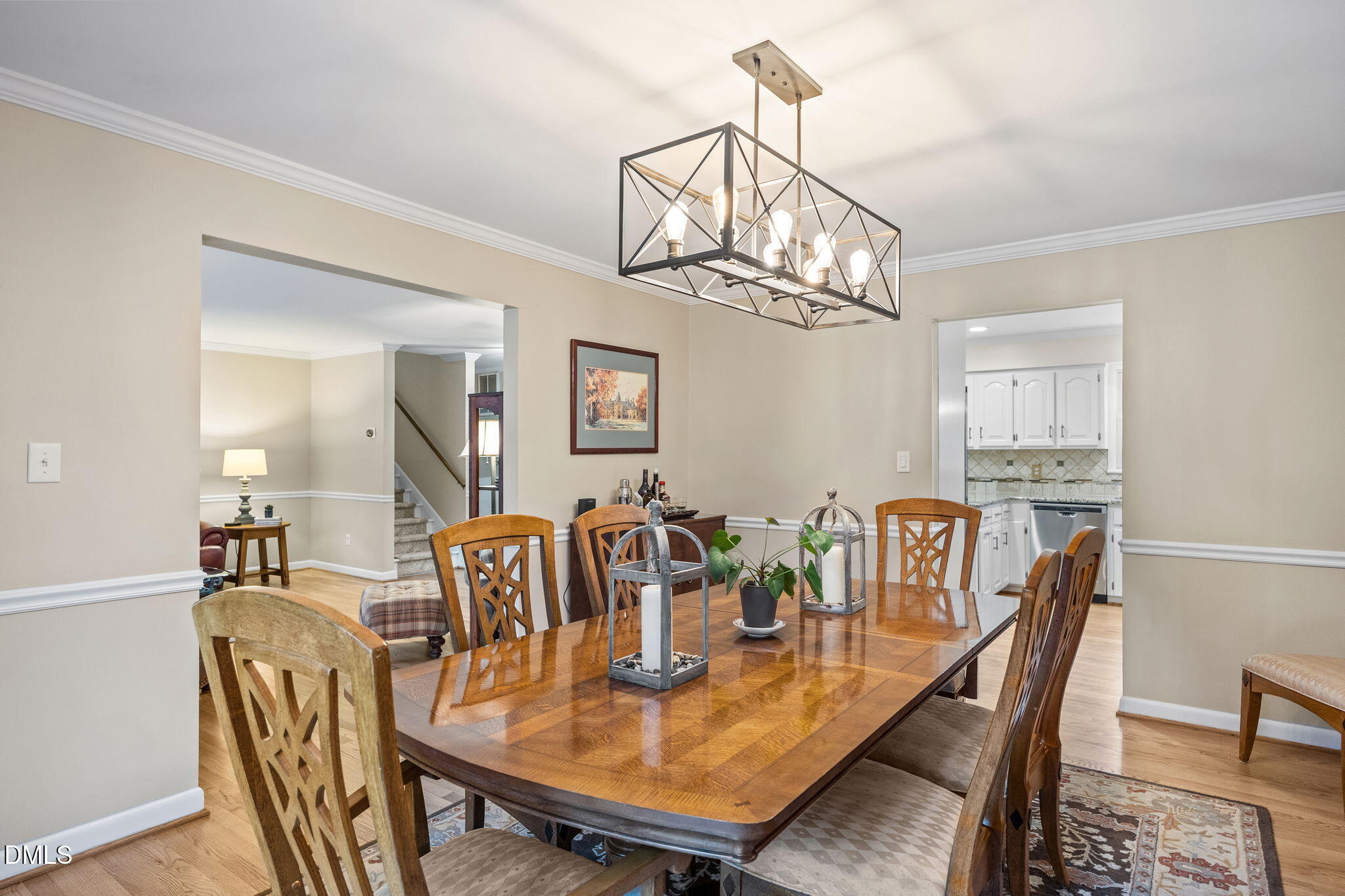 9400 Does Run Court Raleigh, NC 27613 - Photo 10 of 35 a view of a dining room with furniture a chandelier and wooden floor