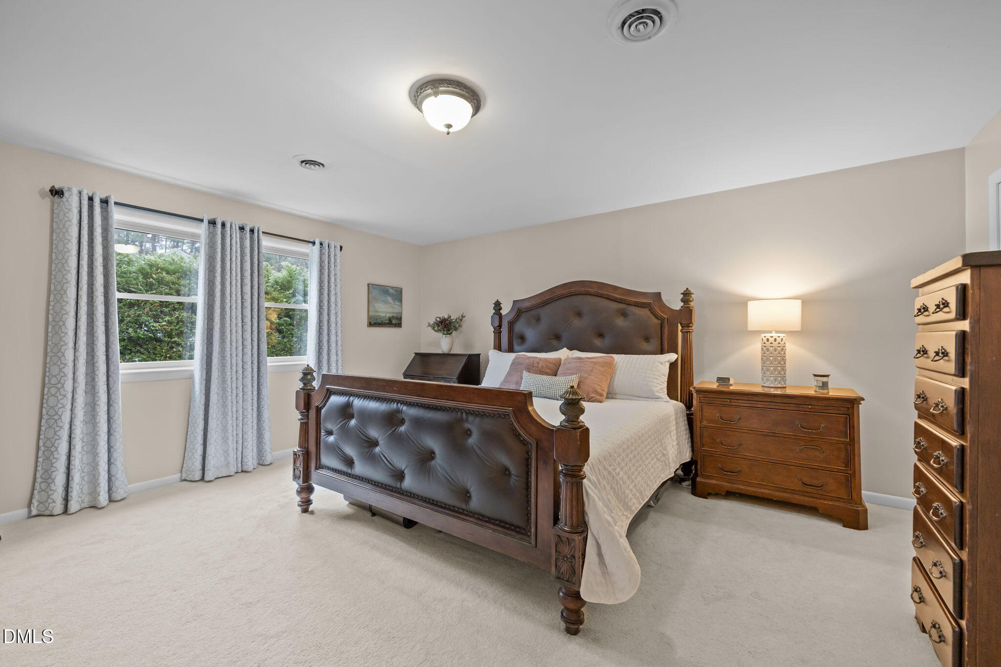 9400 Does Run Court Raleigh, NC 27613 - Photo 15 of 35 a bedroom with a bed and a night stand