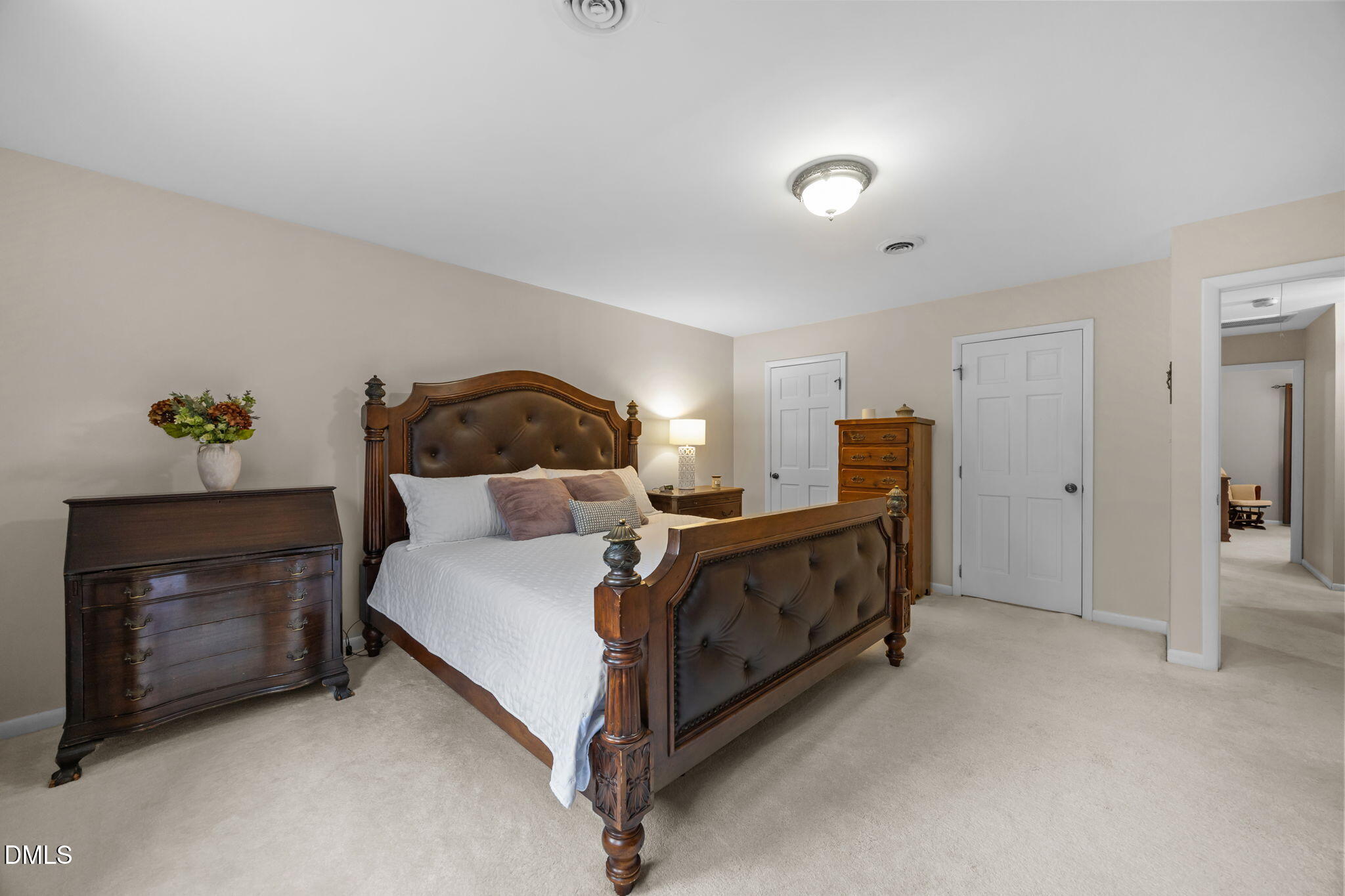 9400 Does Run Court Raleigh, NC 27613 - Photo 16 of 35 a bed room with a bed and a fireplace