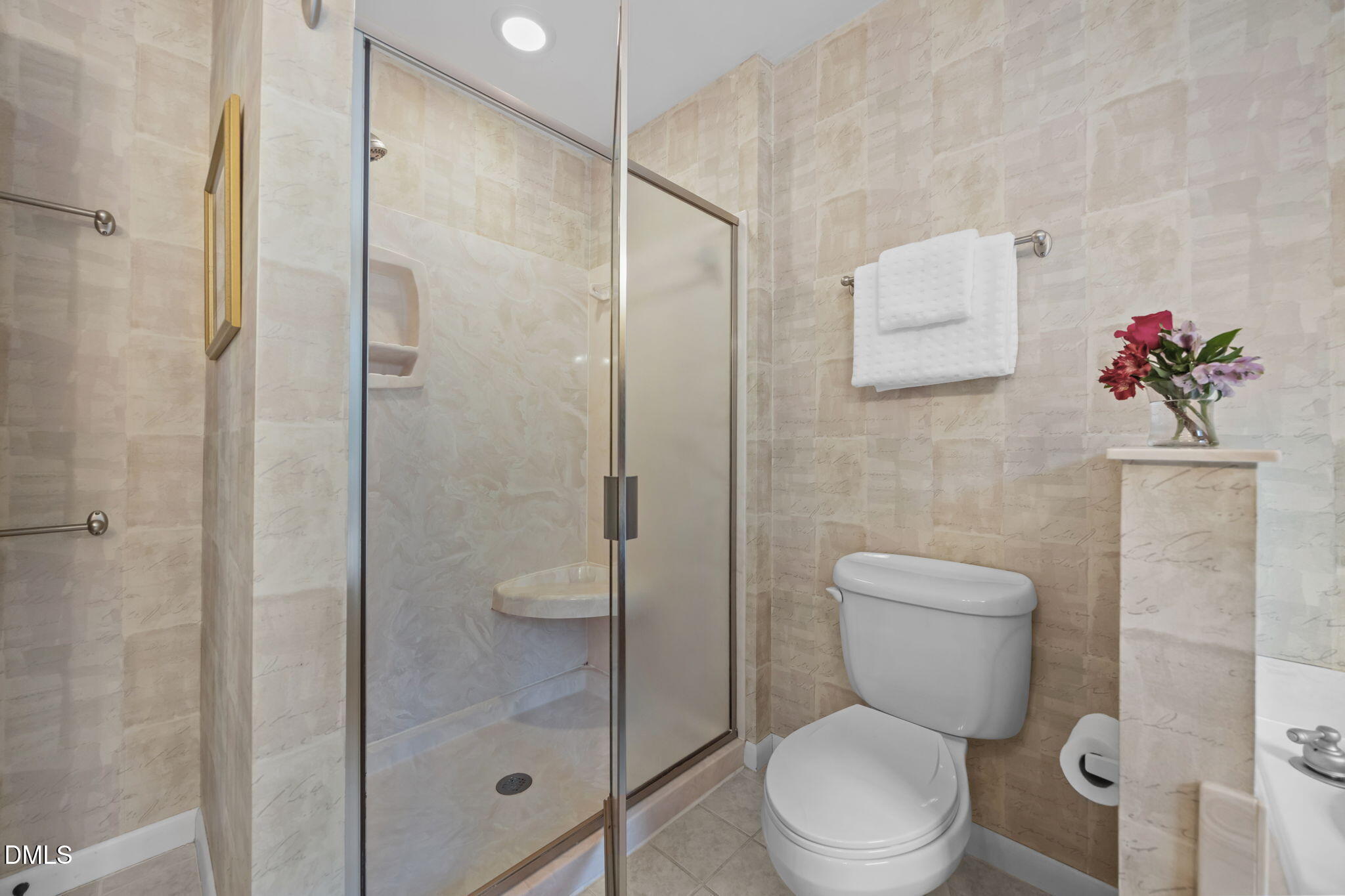 9400 Does Run Court Raleigh, NC 27613 - Photo 18 of 35 a white toilet sitting next to a bathroom sink