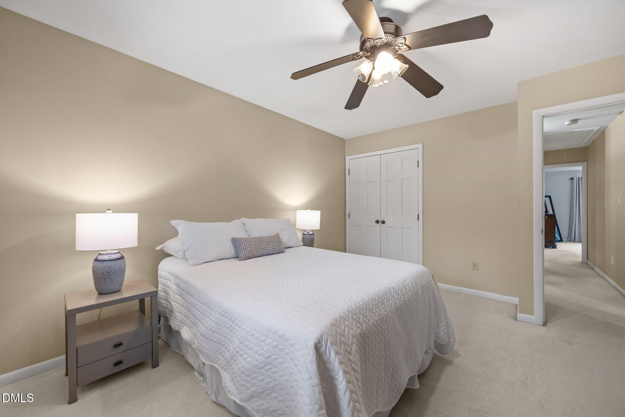 9400 Does Run Court Raleigh, NC 27613 - Photo 20 of 35 a bedroom with a bed and a chandelier