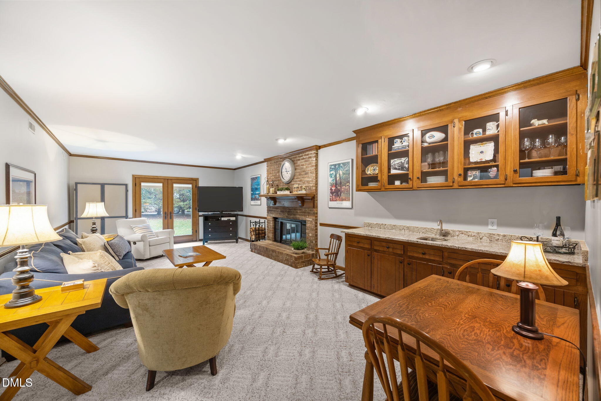 9400 Does Run Court Raleigh, NC 27613 - Photo 23 of 35 a living room with furniture a flat screen tv and kitchen view
