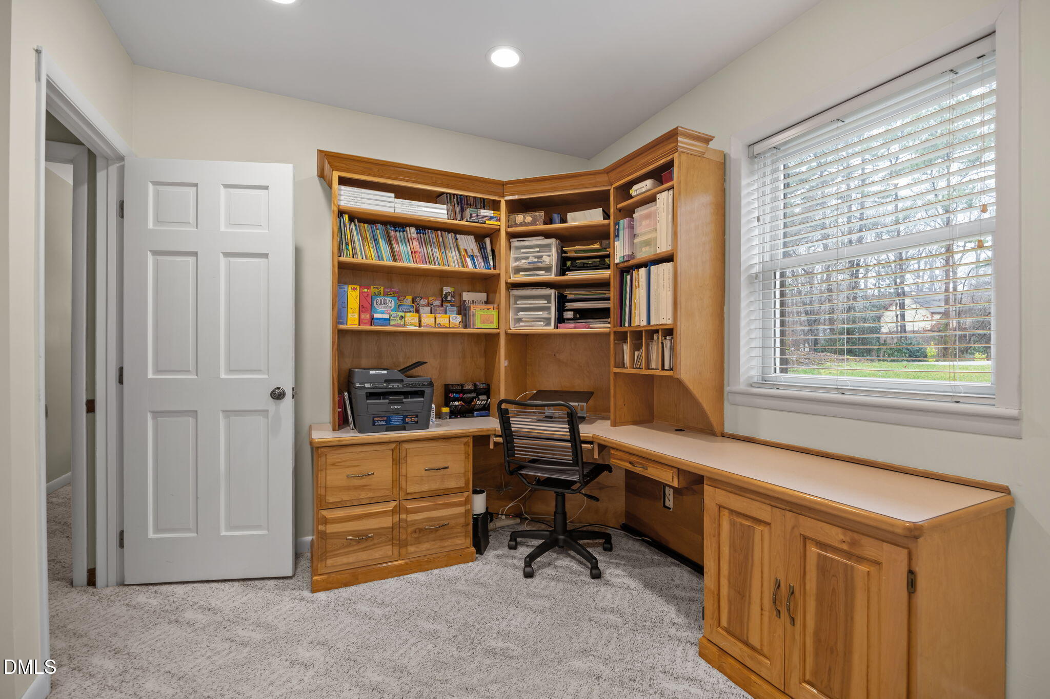 9400 Does Run Court Raleigh, NC 27613 - Photo 27 of 35 a view of a workspace with furniture and a window