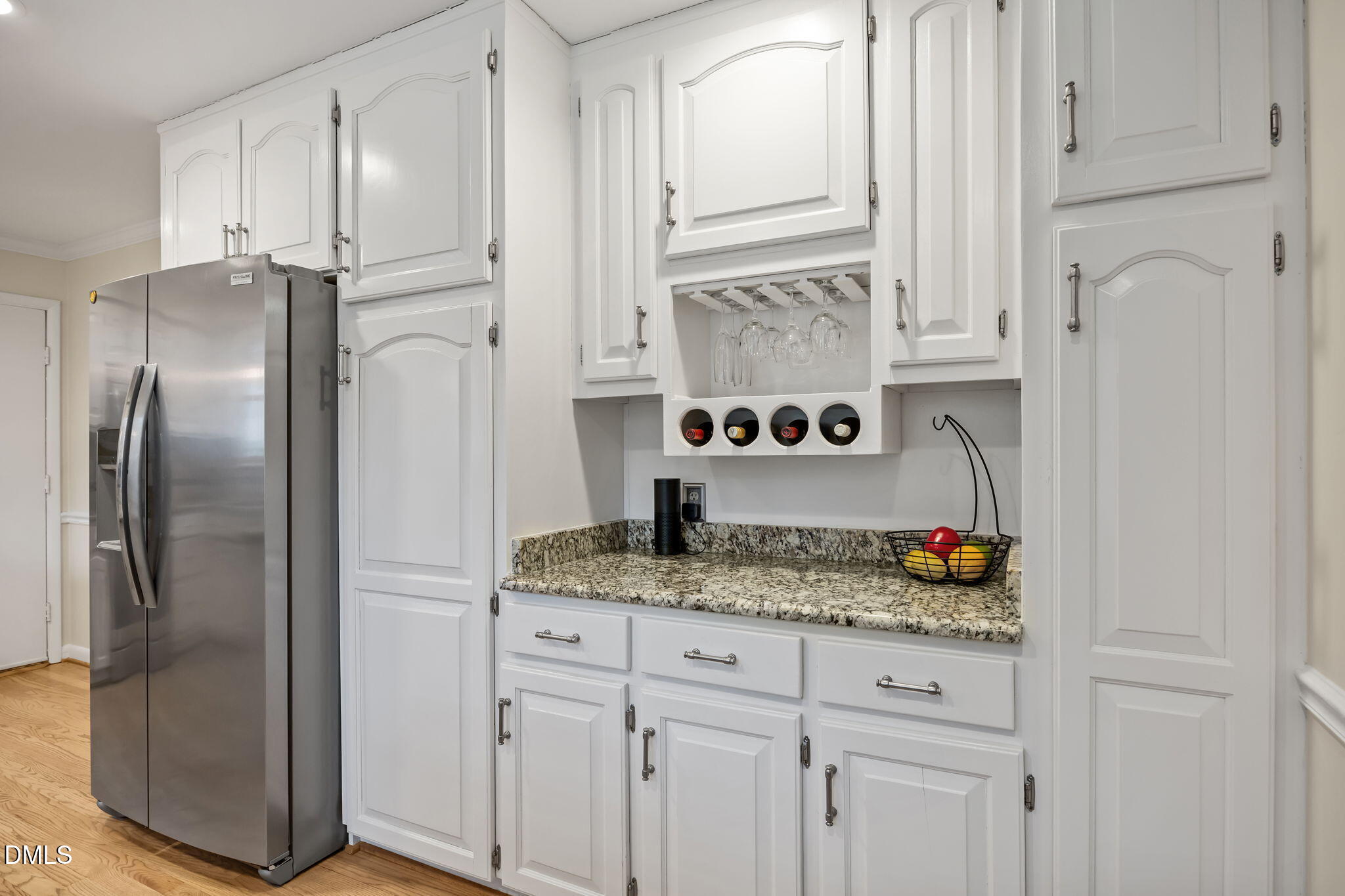 9400 Does Run Court Raleigh, NC 27613 - Photo 7 of 35 a kitchen with stainless steel appliances granite countertop a refrigerator and a sink