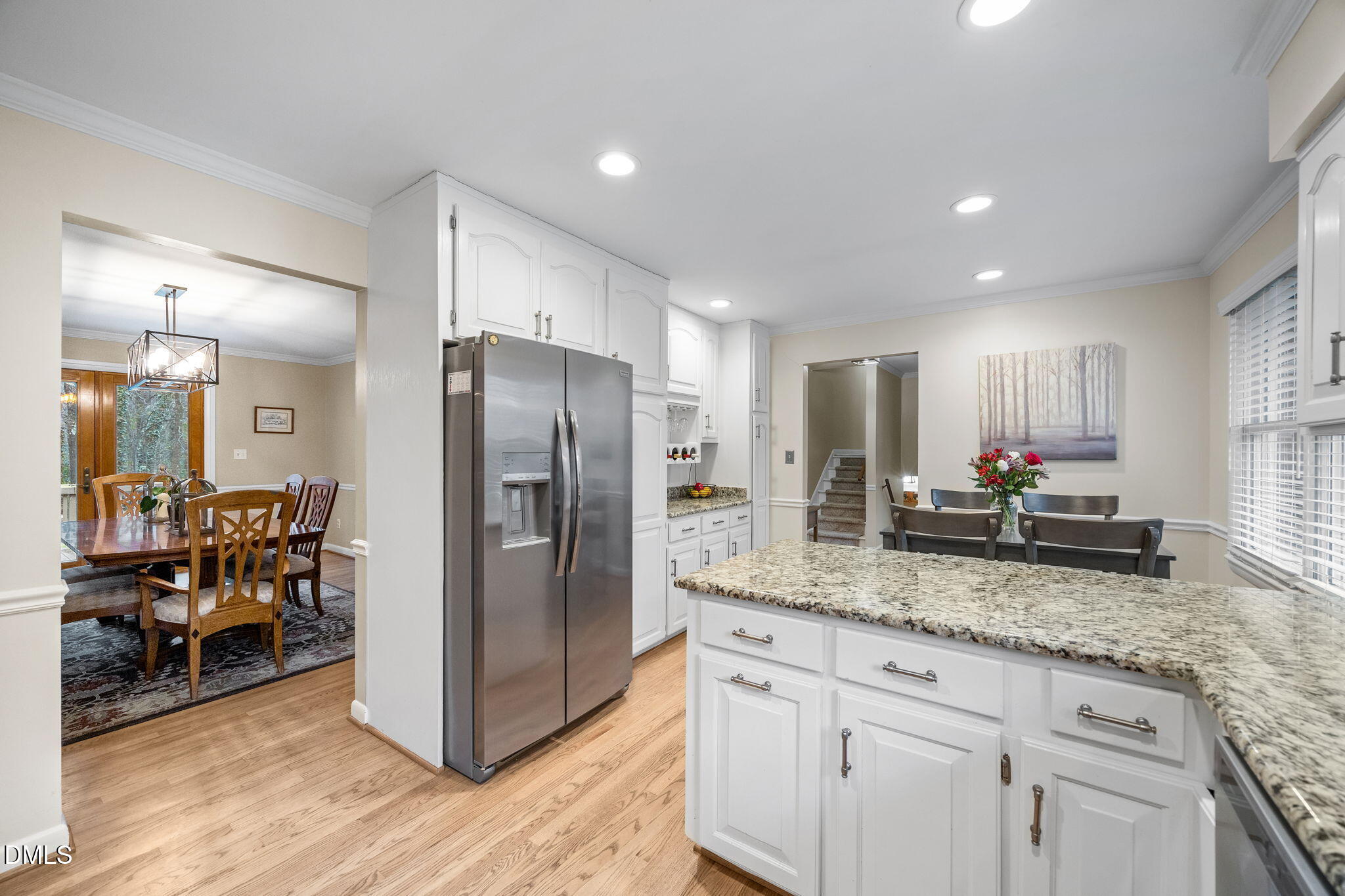 9400 Does Run Court Raleigh, NC 27613 - Photo 9 of 35 a kitchen with stainless steel appliances granite countertop a refrigerator and a sink
