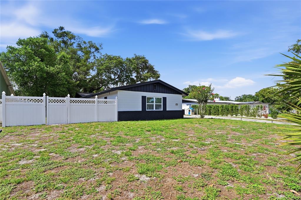 1946 Strathaven Road Winter Park, FL 32792 - Photo 31 of 37 a house with green field in front of it