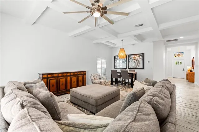 a living room with stainless steel appliances kitchen island granite countertop furniture and a kitchen view