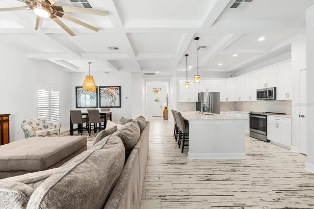 a view of kitchen with cabinets and wooden floor
