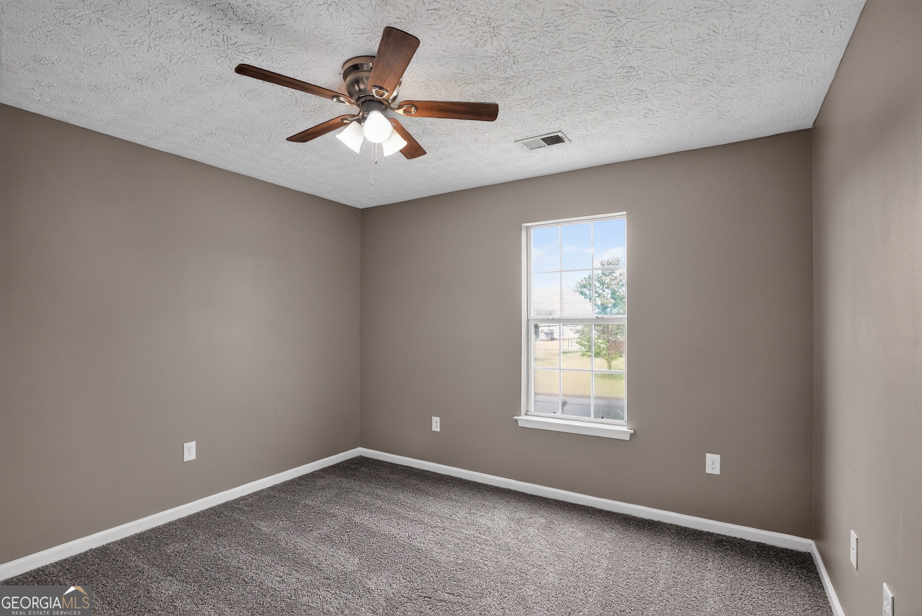 75 Linsley Way Covington, GA 30016 - Photo 32 of 48 a view of an empty room with a window