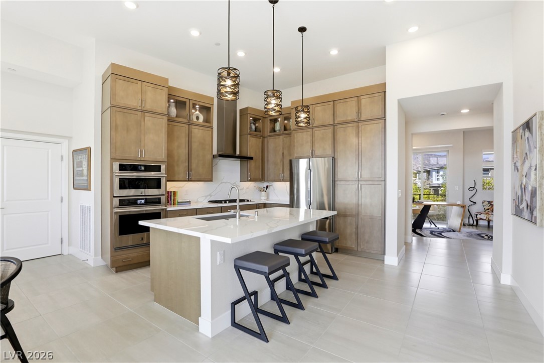 4159 Solace Street, Unit 2 Las Vegas, NV 89135 - Photo 12 of 71 12' ceilings, upper lighted cabinets, upgraded appliances, lighting and countertops.