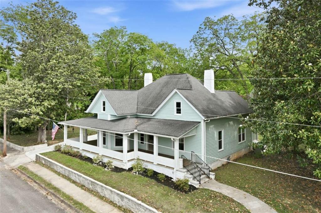 420 Fore Acre Street Cornelia, GA 30531 - Photo 1 of 48 a front view of a house with a yard table and chairs