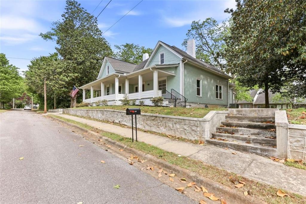 420 Fore Acre Street Cornelia, GA 30531 - Photo 12 of 48 a front view of a house with a yard and potted plants
