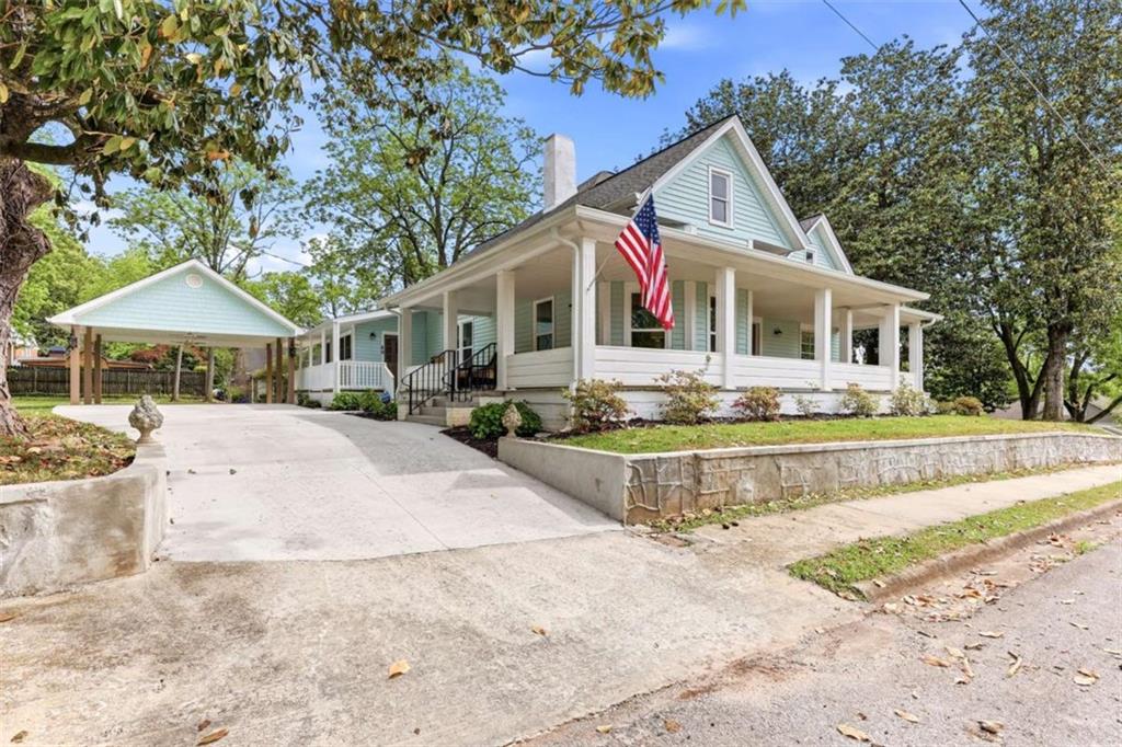 420 Fore Acre Street Cornelia, GA 30531 - Photo 3 of 48 a front view of a house with a yard outdoor seating and garage