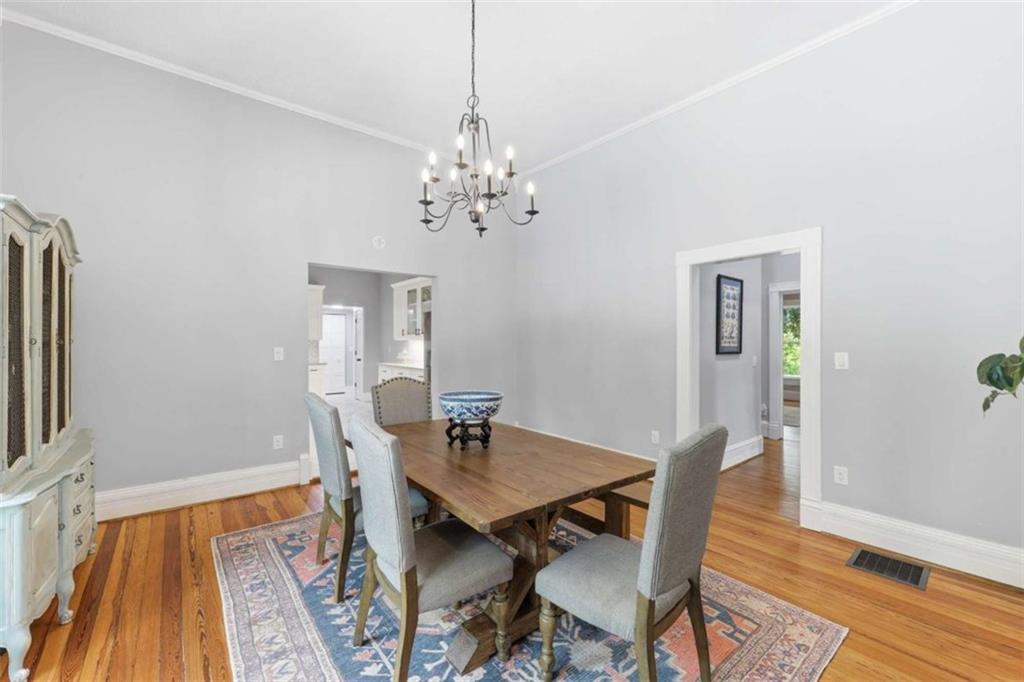 420 Fore Acre Street Cornelia, GA 30531 - Photo 32 of 48 a view of a dining room with furniture and wooden floor