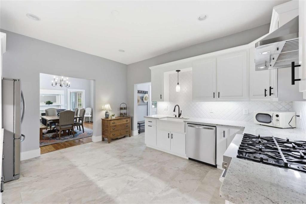 420 Fore Acre Street Cornelia, GA 30531 - Photo 34 of 48 a kitchen with white cabinets and appliances