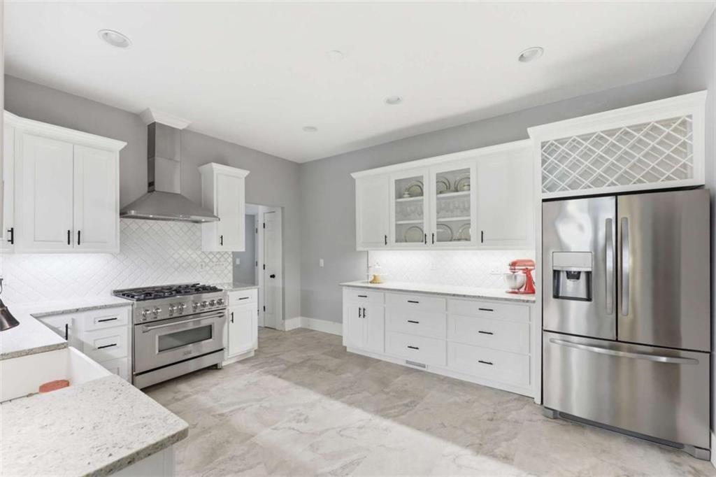 420 Fore Acre Street Cornelia, GA 30531 - Photo 35 of 48 a kitchen with cabinets stainless steel appliances and a counter space