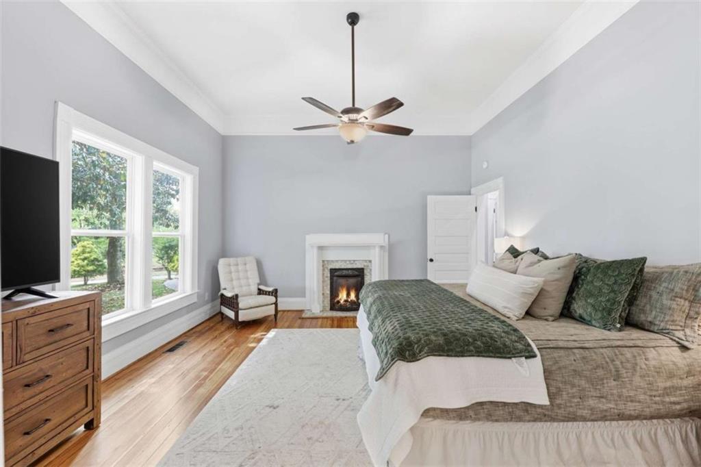 420 Fore Acre Street Cornelia, GA 30531 - Photo 41 of 48 a bedroom with a bed and a fireplace