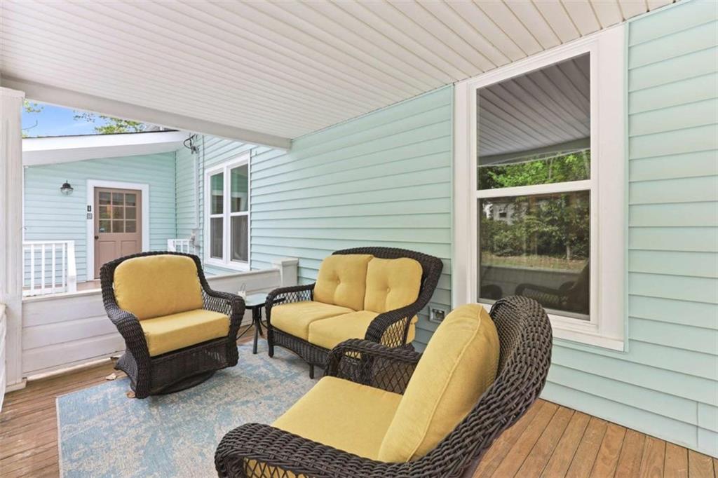 420 Fore Acre Street Cornelia, GA 30531 - Photo 9 of 48 a balcony view with a couch and wooden floor